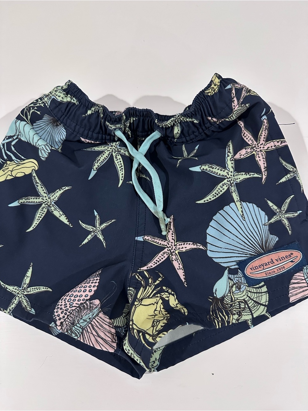 Vineyard Vines Navy Swim Trunks with Pastel Sea Life Print